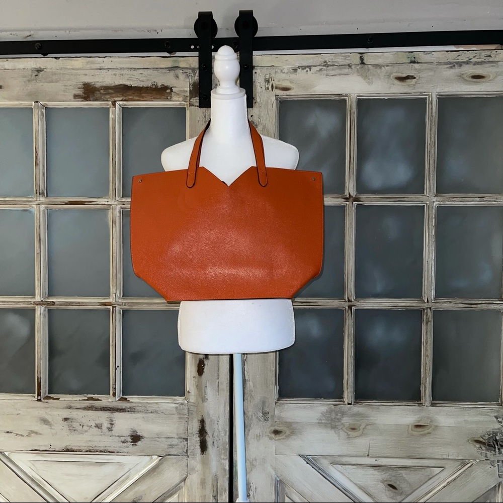 Neiman Marcus orange tote with tassel